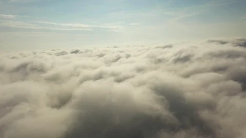Fly on the clouds with the morning sun Clouds move gently in the sky and sun  Stock Footage 119524387