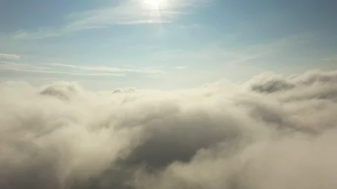 Fly on the clouds with the morning sun Clouds move gently in the sky and sun lig Stock Footage 119877553