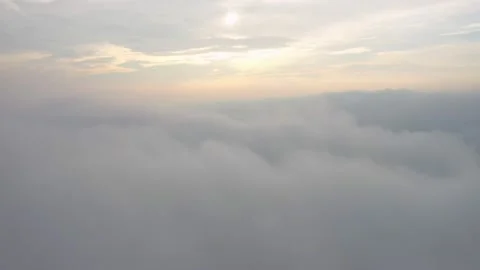 Fly on the clouds with the morning sun Clouds move gently in the sky and sun  Stock Footage 153534811