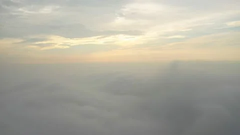 Fly on the clouds with the morning sun Clouds move gently in the sky and sun  Stock Footage 153534819