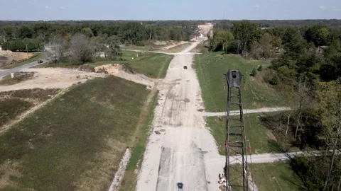 Fly by crane on a dirt construction road Stock Footage 294040870