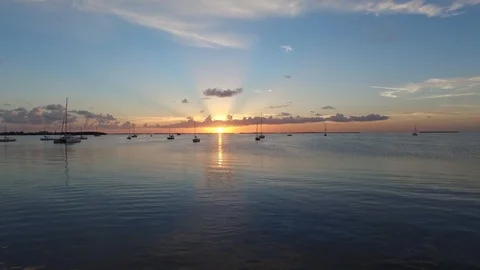 Fly by dock over ocean sunset Stock Footage 97134209