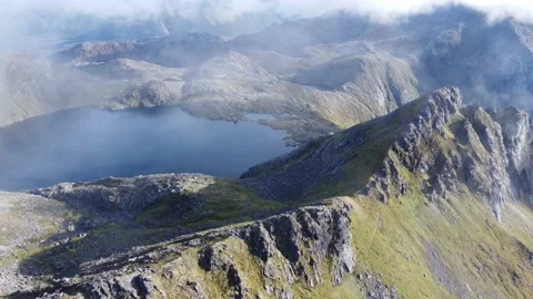 Fly down to high lake in clouds part 2 Stock Footage 219785224