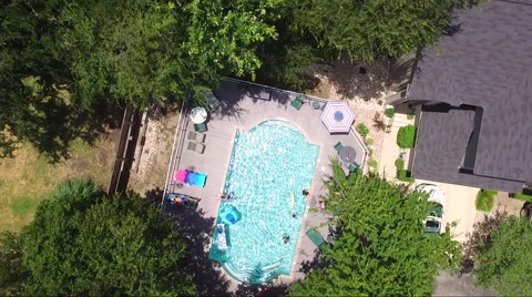Fly Down Over Pool Activities Stock Footage 65795623