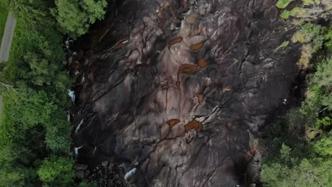 Fly down over a small river tilt reveal in Norway Stock Footage 248364920