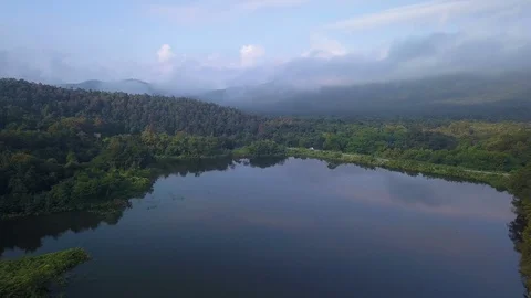 Fly down to see lake, mountain and cloud at Chiang Mai, Thailand Stock Footage 100828929