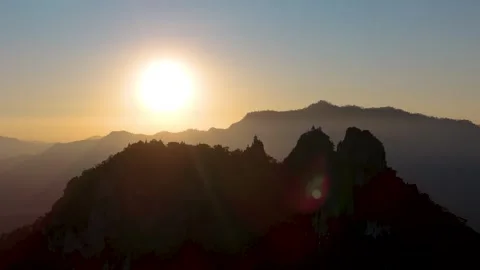 Fly from far towards Wat Phra Phutthabat Sutthawat at sunset, Thailand Stock-Footage 330962590