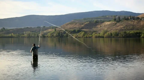 Fly fisherman Casting in Sunlight Stock Footage 35174643