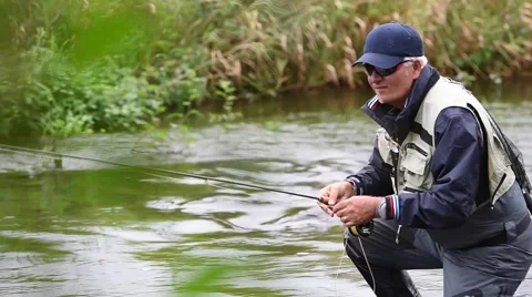 Fly-fisherman fishing in river Stock Footage