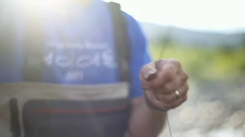 Fly Fisherman's Hands and Pole while he casts Stock Footage 35174553