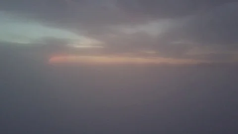 Fly form misty clouds during sunrise. Stock Footage 80005423