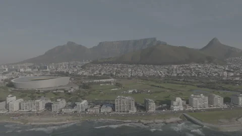 Fly by of Greenpoint coastline with Table Mountain as a backdrop Stock Footage 317995918