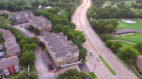 Fly Half Circle Over Road And Apartment Complex Stock Footage 65796295