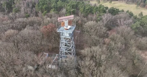 Fly high above the trees and witness the impressive radar installation Video stock 233377929