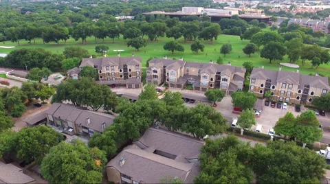Fly Low Over Apartment Complex And Golf Course Stock Footage 65796303
