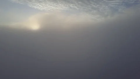 Fly from the mist, above the clouds during sunrise. Stock Footage 80025835