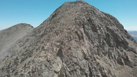 Fly up mountain to find people on the summit 스톡 동영상 166372659