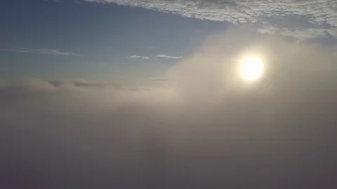 Fly move to left, above the clouds during sunrise. Stock Footage 80017008