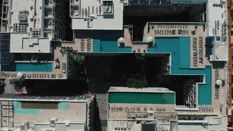 Fly out of the big rooftop pool. Top view of the hotel in the resort town. Stock Footage 168156057
