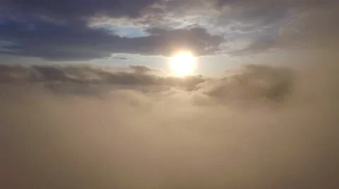 Fly out from the cloud to the delightful view of the setting sun Stock Footage 63474081