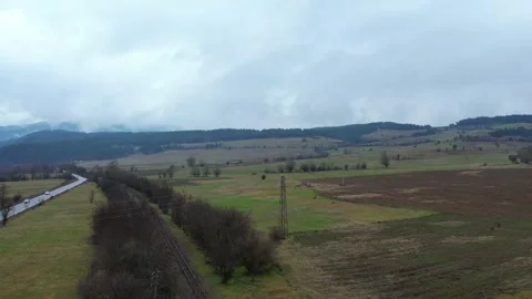 Fly Ove rTrees Train Tracks Mountains 動画素材 225705208