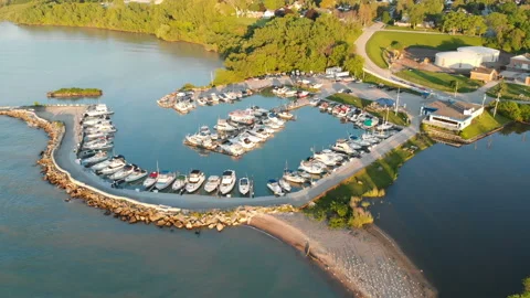 Fly over aerial view of the Michigan lake shore line, pier, yacht club Stock Footage 111430587