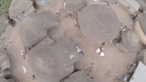 Fly over African huts during the wet season original color Stock Footage 84072985