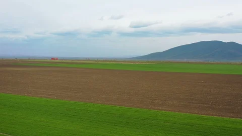 Fly over agricultural fields in springtime Stockbeeldmateriaal 128245987