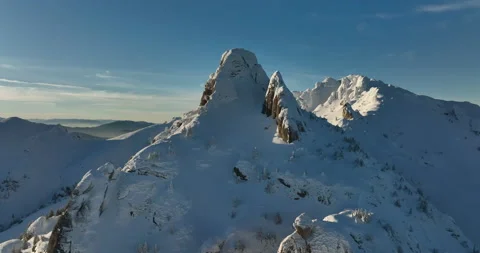 Fly over and around the mountains of Ciucas Romania in January 2022 Sunny day. Stock Footage 170200360