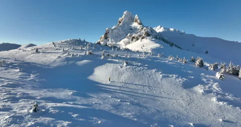 Fly over and around the mountains of Ciucas Romania in January 2022 Sunny day. Stock Footage 170200949