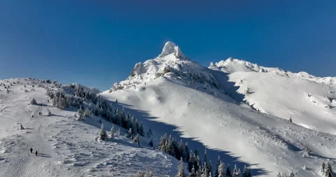 Fly over and around the mountains of Ciucas Romania in January 2022 Sunny day. Stock Footage 170201209