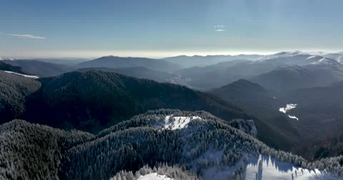 Fly over and around the mountains of Ciucas Romania in January 2022 Sunny day. Stock Footage 170201696