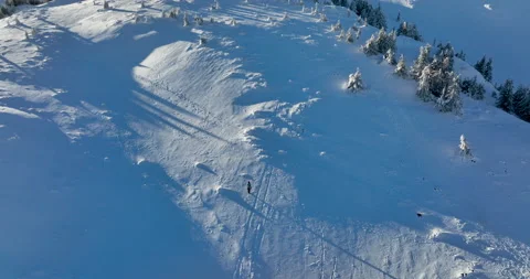 Fly over and around the mountains of Ciucas Romania in January 2022 Sunny day. Stock Footage 170201839