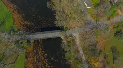 Fly-over and pull back from Fallsburg park covered wooden bridge,Michigan Stock-Footage 56328155