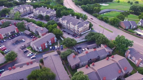Fly Over Apartment Complex And Road Stock Footage 65796602