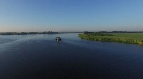 Fly over а barge floating in the river. Aerial view. Stock Footage 64819298