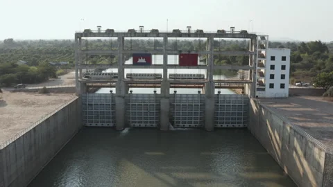 Fly over barrage with flag of China and Cambodia in Battambang province Stock Footage 141999165