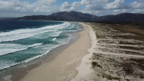 FLY OVER THE BEACH SUNNY DAY WAVES Stock Footage 99830224