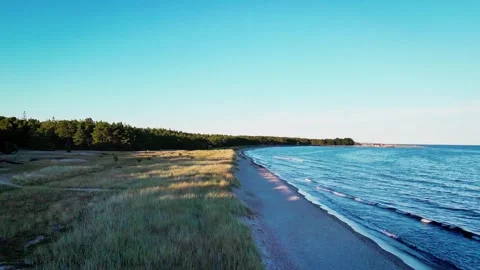 Fly-over beach in sunset on Gotland, Sweden Stock Footage 247049645