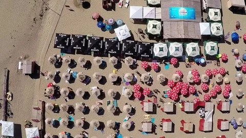 Fly over beach umbrellas Video stock 81448633