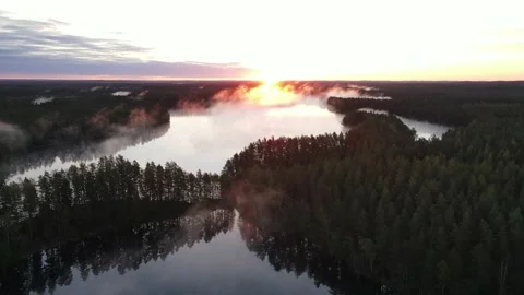 Fly over beautiful calm lake in the morning mist. Stock Footage 168569731