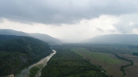 Fly over beautiful mountain ladscape with river and green trees on the hills Stock Footage 95988925