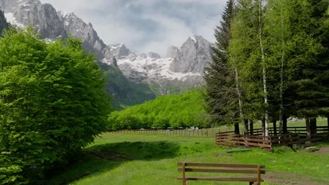 Fly over the bench on meadow in the mountain valley Stock Footage 250000897