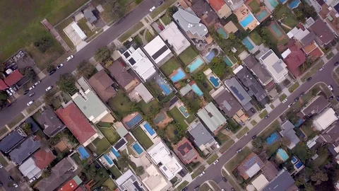 Fly over birds eye view of suburban neighbourhood Stock Footage 90831240