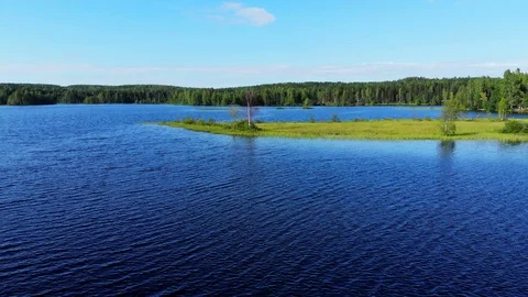 Fly over blue lake waters Stock Footage 92332286