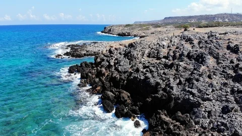 Fly up over blue sea, rocky beach and hills, Crete, Greece Stock Footage 101071282