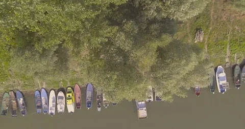 Fly over boats and river bank Video stock 80628500