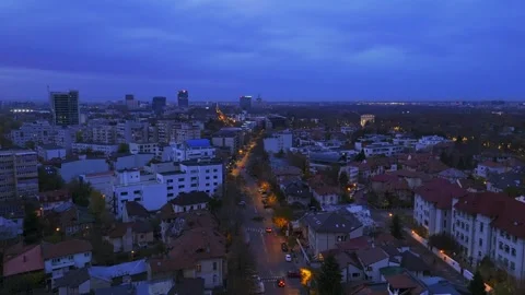 Fly over Bucharest City at night sunset with traffic on main boulevard. Video stock 257298753