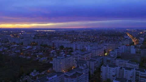 Fly over Bucharest City at night sunset with traffic on main boulevard. Video stock 257299022