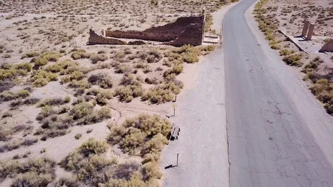 Fly over building ruins in ghost town Rhyolite Stock Footage 92828230